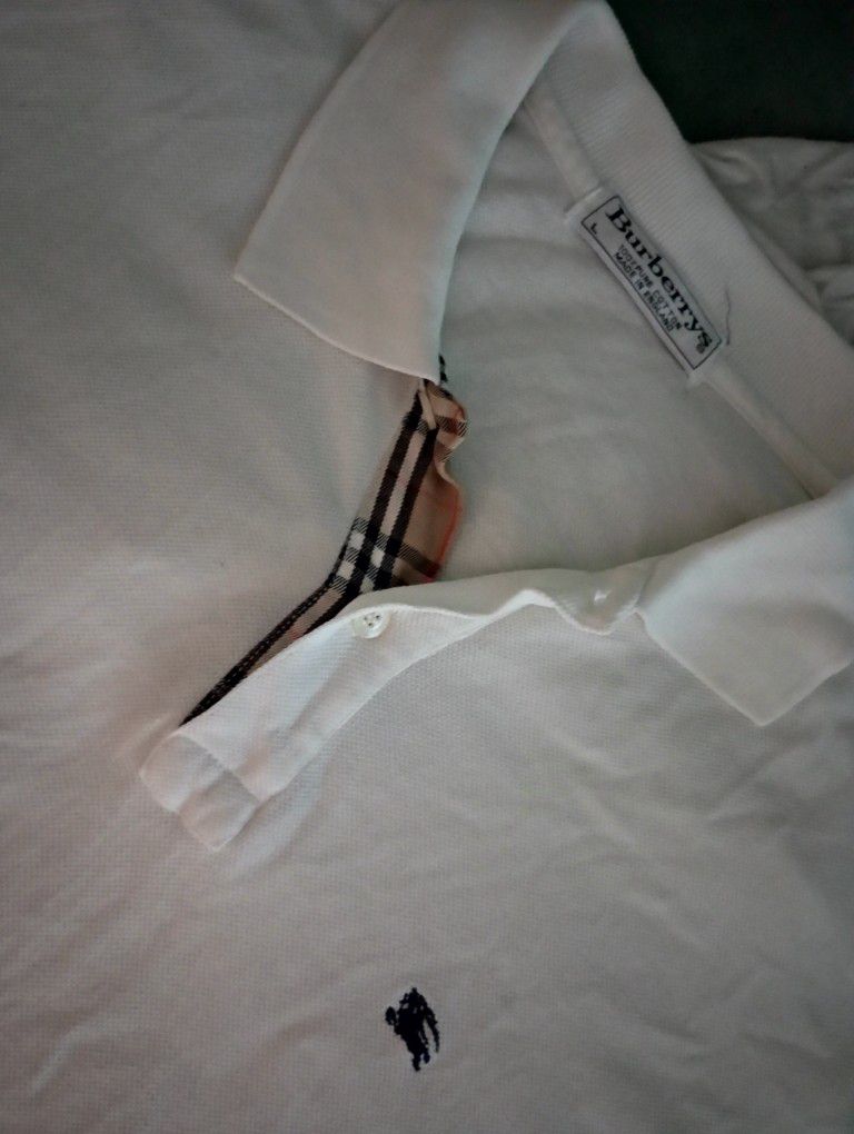 Burberry White Polo Shirt With A Pair Of Burberry Shades 