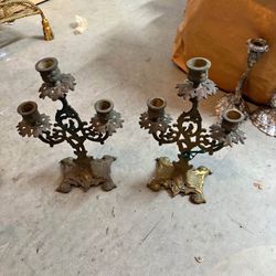 pair of antique Victorian-style brass candelabras.