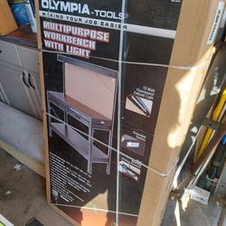 Olympia tools , multi purpose workbench with light and pegboard