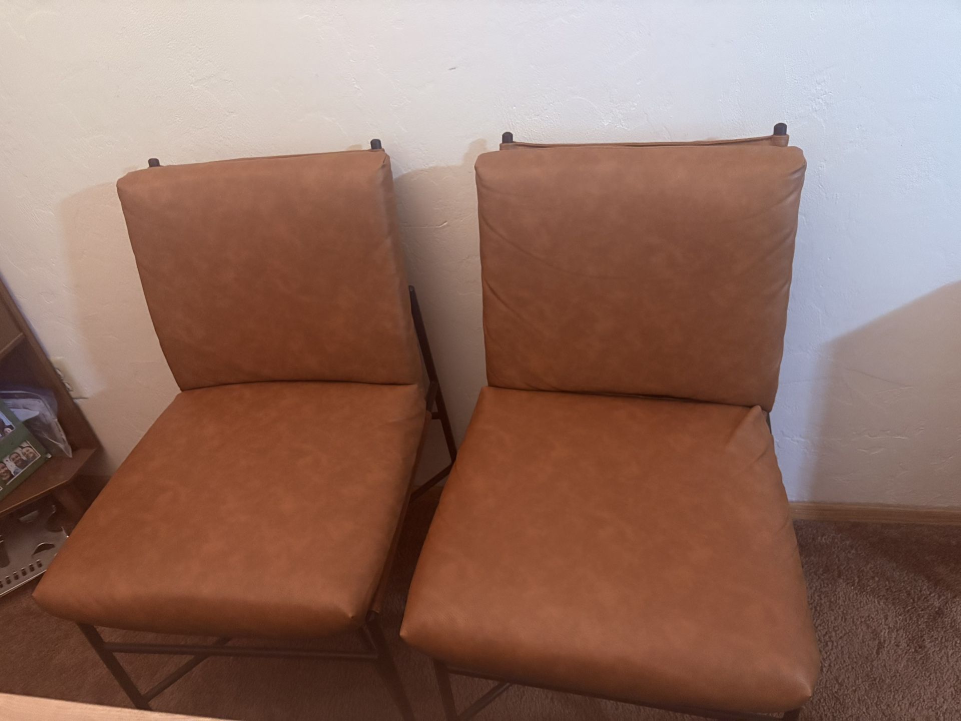 Two Brown Leather Chairs