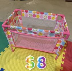 Pink and multicoloured polka dot playpen