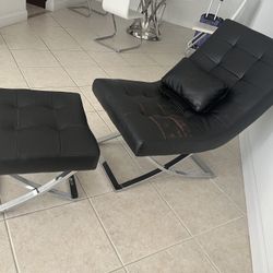 Black leather lounge chair with ottoman.