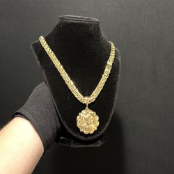 14K Gold filled chino link chain with a Jesus christ Pendant 