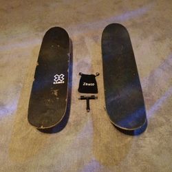 2 skateboards and a skate tool