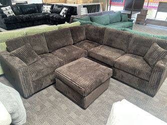 Comfy Chocolate Brown Sectional And Ottoman 