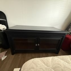 Black wood tv stand with glass doors