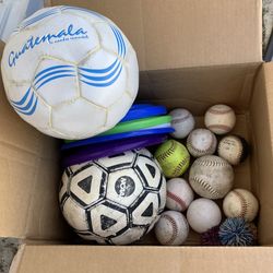 Box of sports balls soccer baseball frisbees