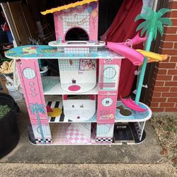 DOLL HOUSE. 48"w x 12"deep x 50 1/2"high; cross streets are Arapaho & Waterview 