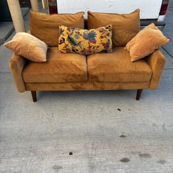 Orange Loveseat And Pillows