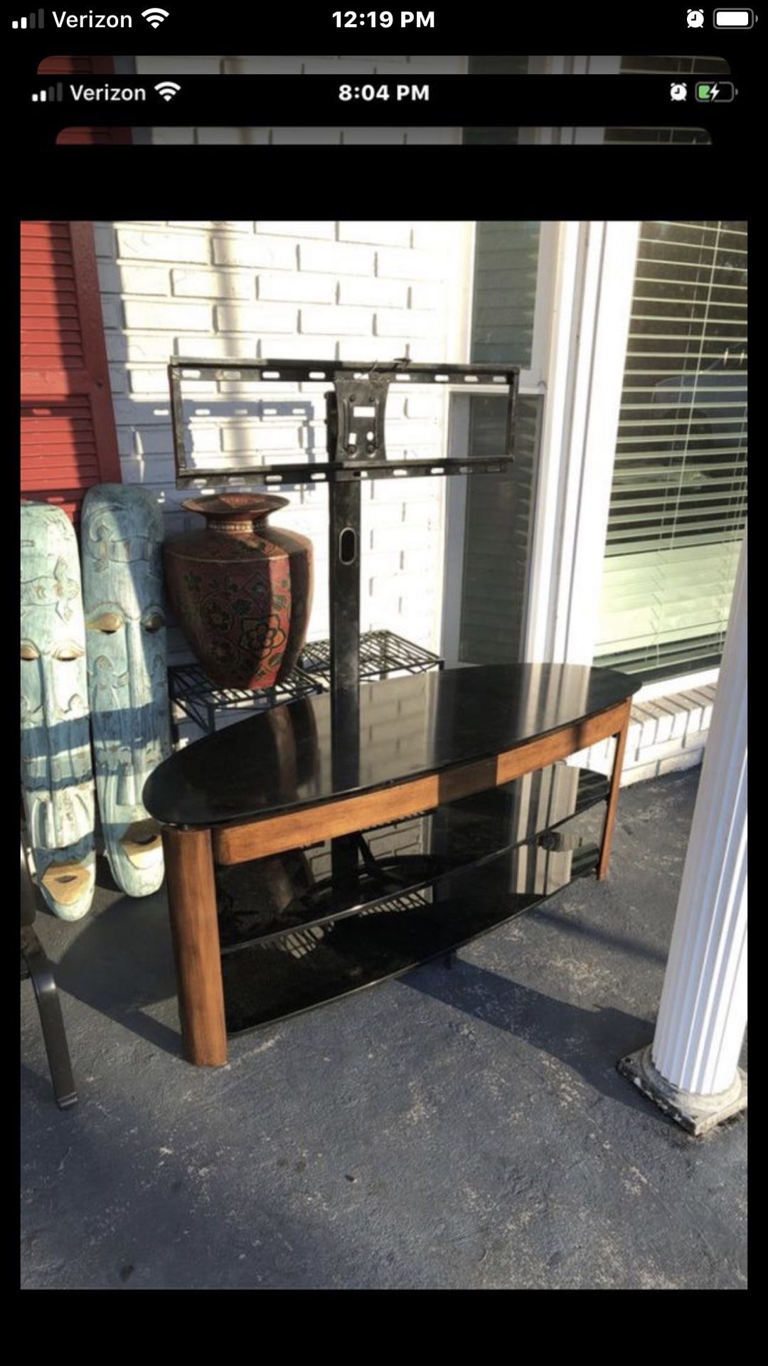 Three shelve tv stand needs cleaned but solid found in storage unit