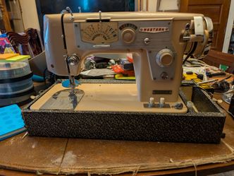 Antique "Western" sewing machine in case