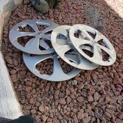 3 Toyota original hubcaps