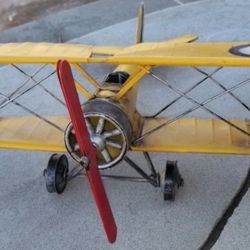 Vintage metal Yellow airplane. Cool piece!