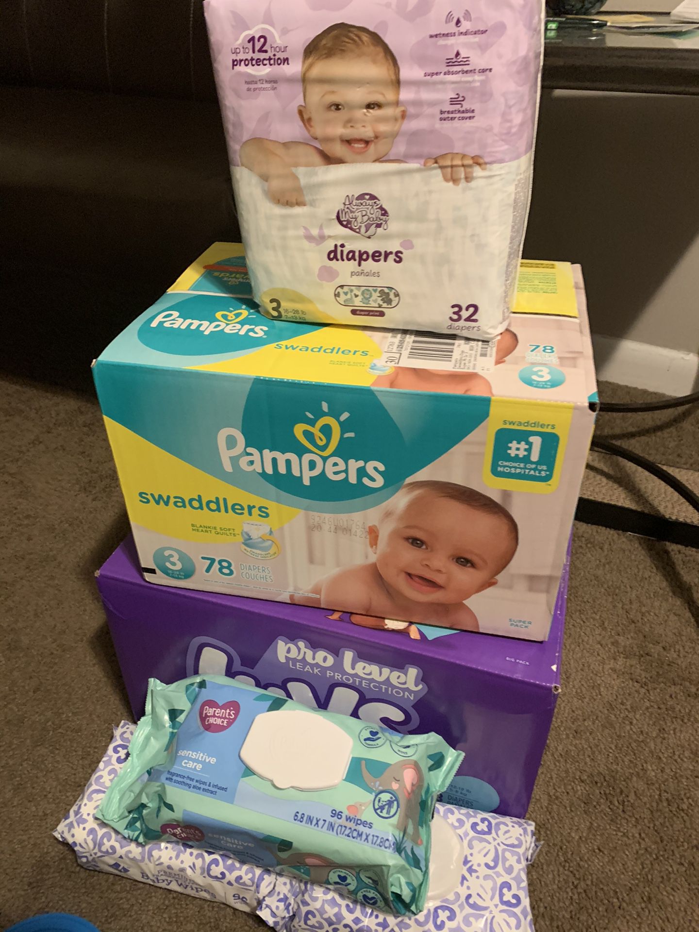 3 boxes of diapers (2&3)and wipes and extra diapers PAMPERS LUV lot