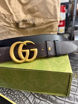 Authentic Gucci Brown and black flip buckle size 42 In very good condition