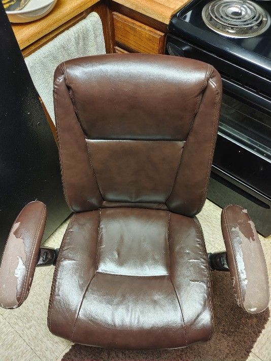 Swivel and tilt, rolling Leather office chair