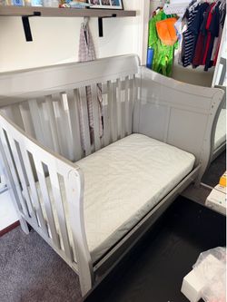 Toddler bed with side changing table
