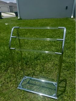 Selling a towel rack with a glass shelf.