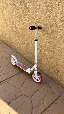 Pink and white kick scooter