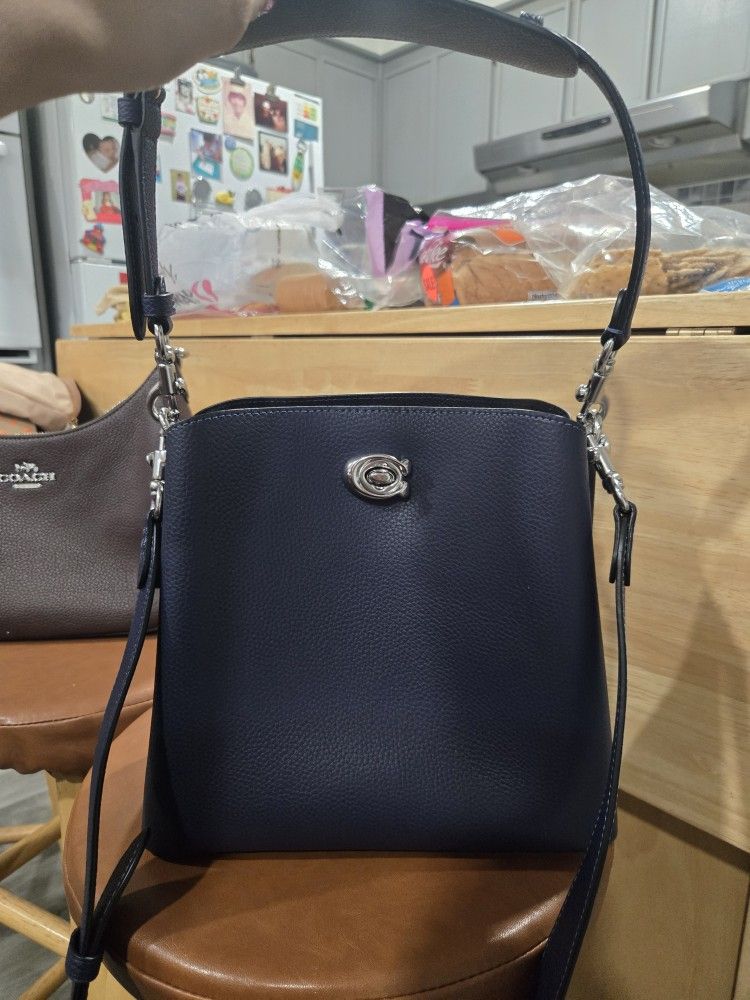 NAVY BLUE COACH BUCKET BAG
