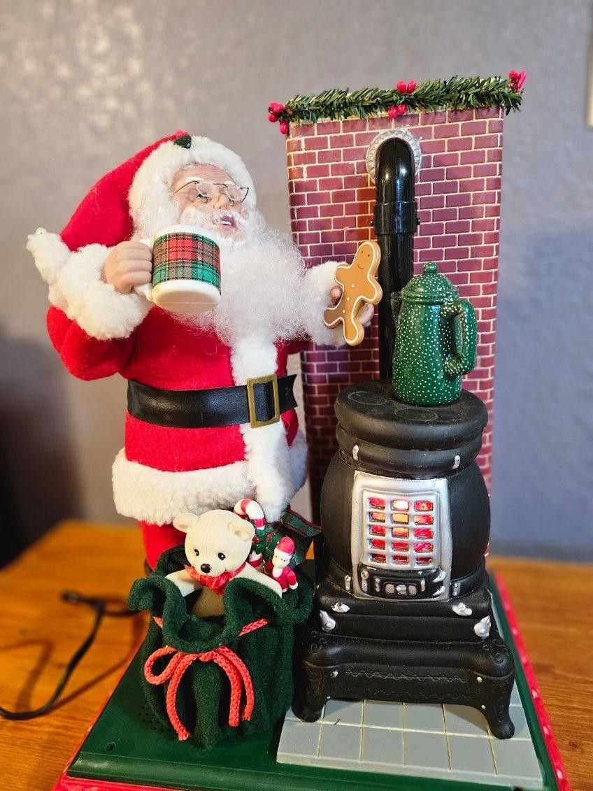 Holiday Creations Animated Santa Claus Holiday Scene With Pot Belly Stove with Lights and Sound in his original box with replacement bulb 1994