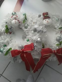 Two Decorated White Christmas Wreaths