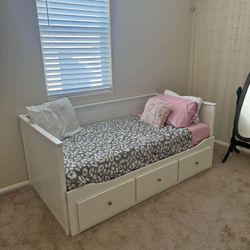 white twin size bed with storage drawers