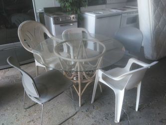 Glass Patio Table and Misc Chairs