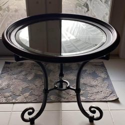 Foyer Table, glass top with wood trim and wrought iron base.