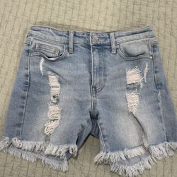 Guess 1981 Midi Jean Shorts in a light blue destroyed denim with a frayed hem