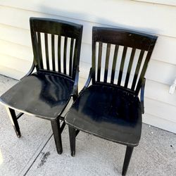 Two black wood dining bistro chairs