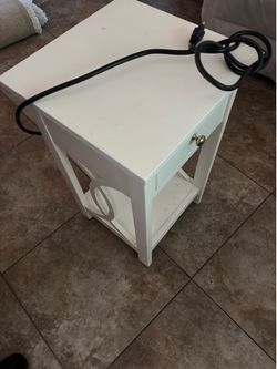 End table with electrical outlets plus phone charger