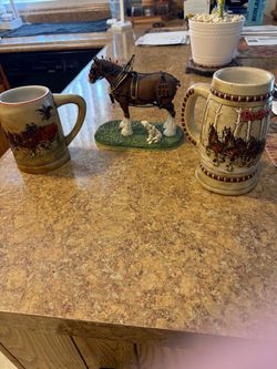 Budweiser steins and figurine