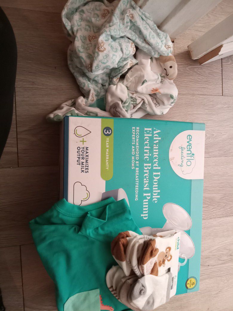 Automatic Double Breast Pump W/ Some Baby Clothes