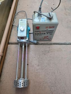 Paint mixer. With adjustable speed .