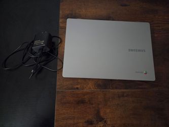 Samsung Chromebook 4 (Model XE310XBA) with its original power adapter