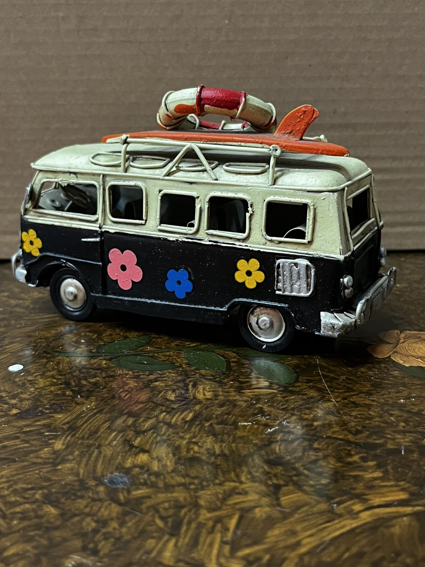 Vintage Toy Car Decor Retro hippie van, hippie van in blue black and white with painted flowers and surfboards on the baggage rack, collectible van