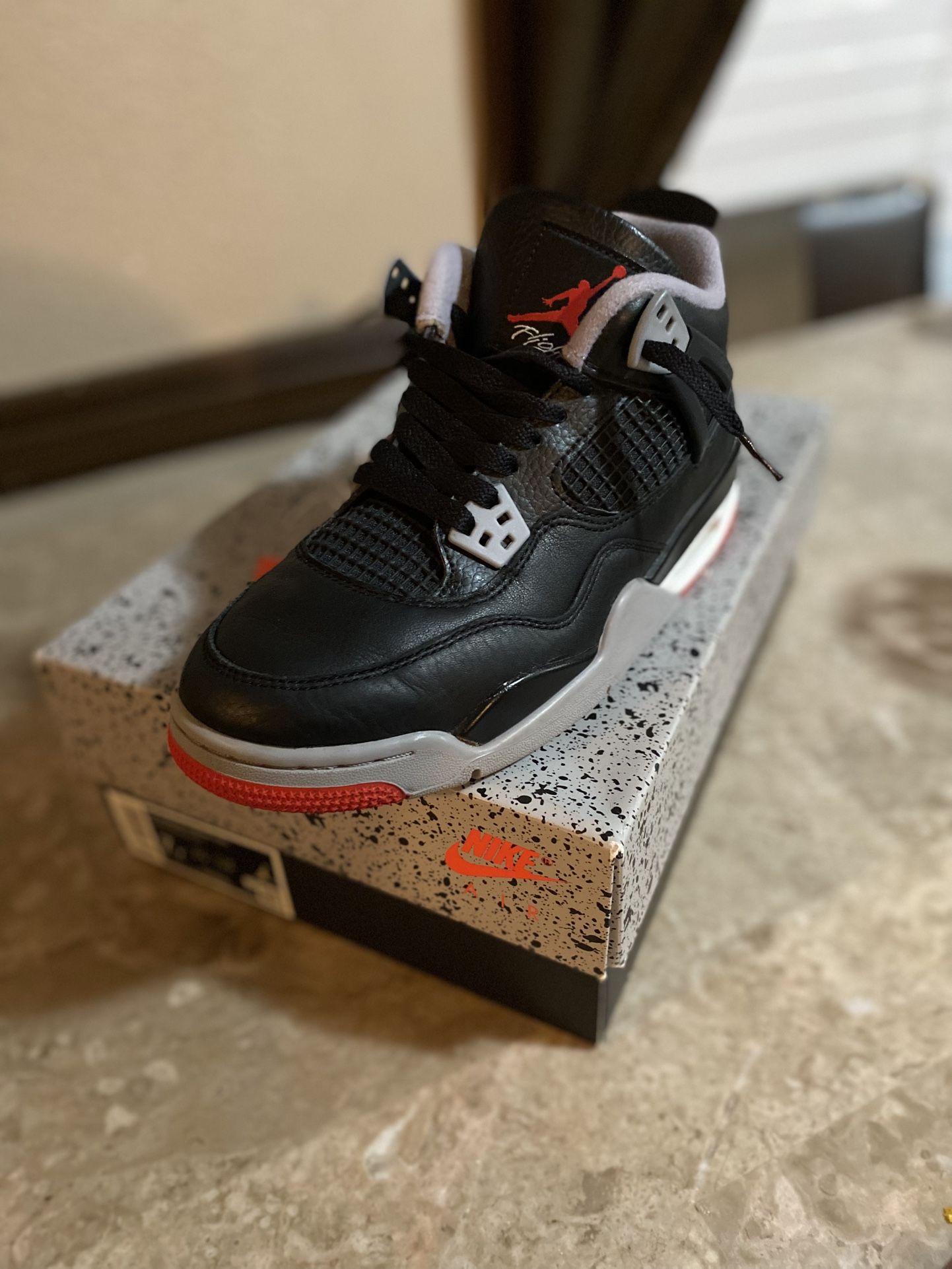 Air Jordan 4s Retro Bred