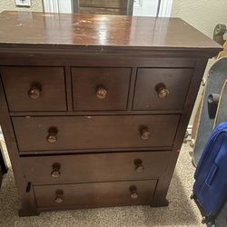 Dark brown dresser/chest of drawers