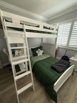 Bunk bed in white with attached desk only $500