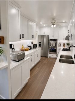 White shaker, Cabinets, quartz countertops, sink and faucet stainless steel 6 inch backsplash or full backsplash
