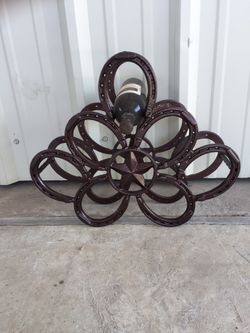 Wine rack made from horseshoes—powder coated