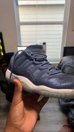 Air Jordan 11 Low sneakers in a navy/blue colorway.
