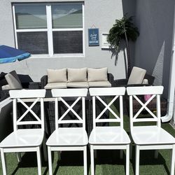 4 white wooden chairs for sale.
