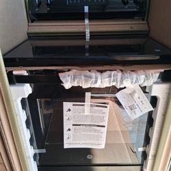 GE - 5.3 Cu. Ft. Freestanding Electric Range with Steam Cleaning and 4 Burner Radiant Cookto