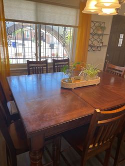Solid wood table with 8 chairs. Excellent quality