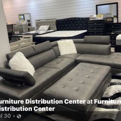 CONTEMPORARY BLACK OR GRAY SECTIONAL WITH OTTOMAN