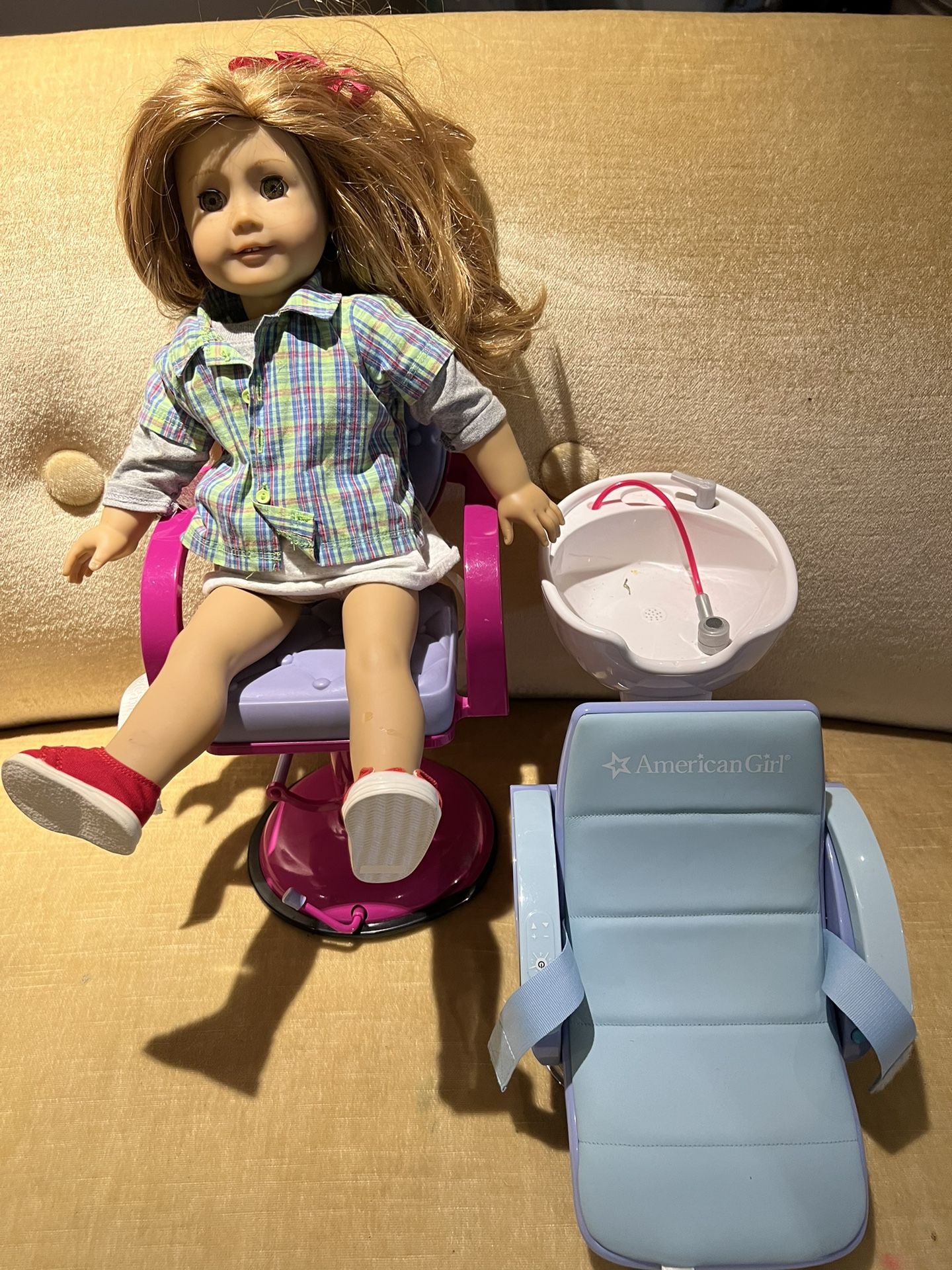 American girl, doll and a high chair and a salon chair for hair wash