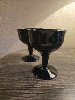 Beautiful set of two (2) vintage mid-century modern black glass coupe stems.