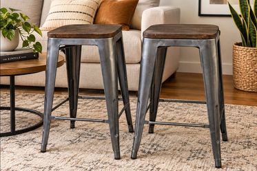 Two stool 24-inch

industrial-style stools with wooden tops
